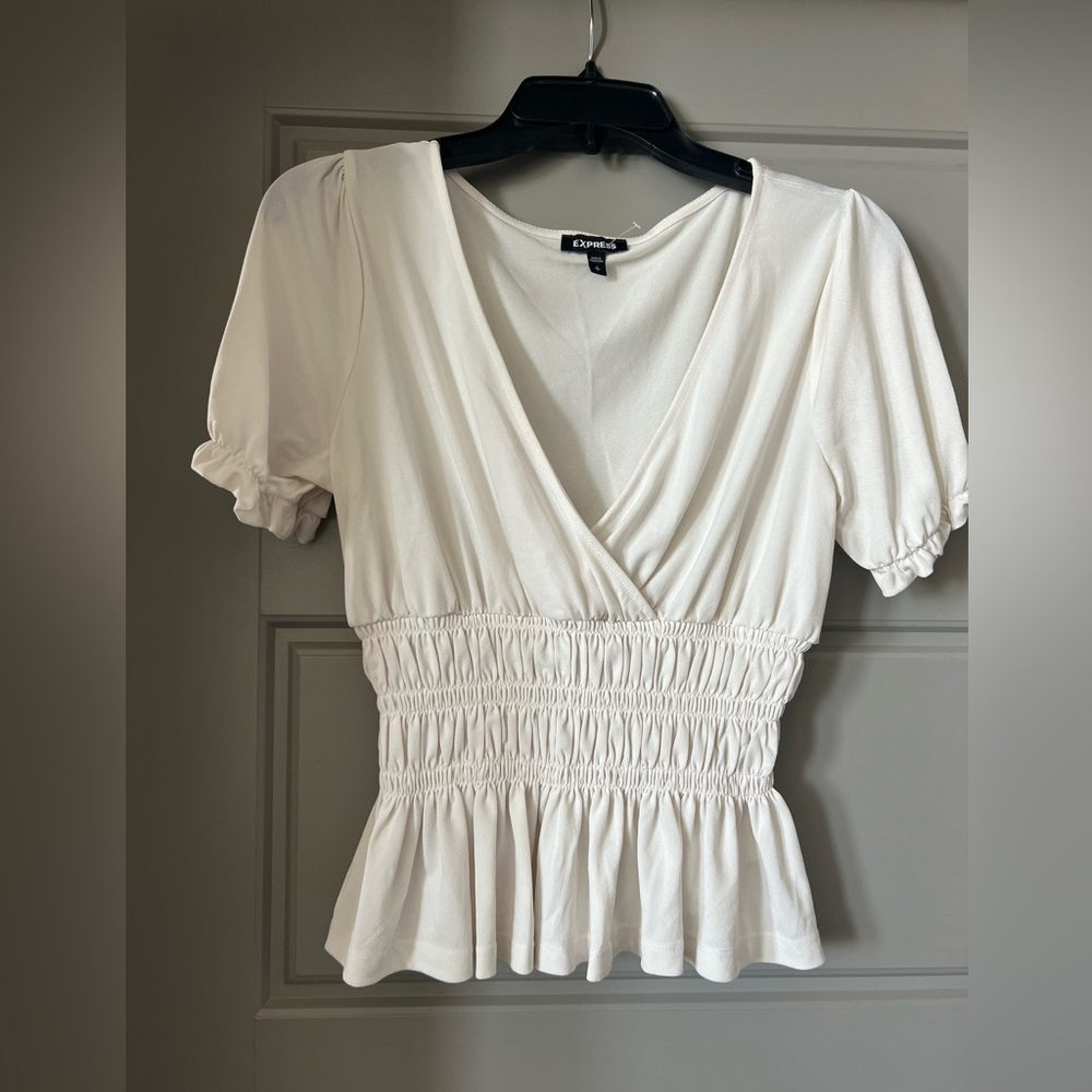 Ivory Express peplum top🤍